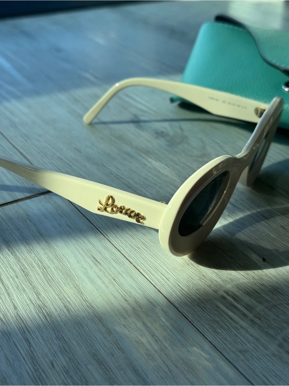 Loewe Ivory Oval Sunglasses with Dark Lenses
